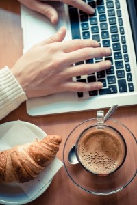 7010114-close-up-hands-multitasking-man-using-tablet-laptop-and-cellhpone